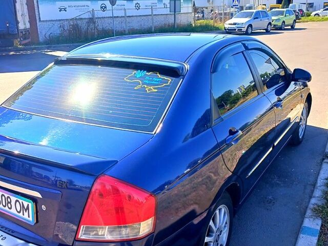 Синій Кіа Черато, об'ємом двигуна 1.6 л та пробігом 205 тис. км за 4500 $, фото 2 на Automoto.ua