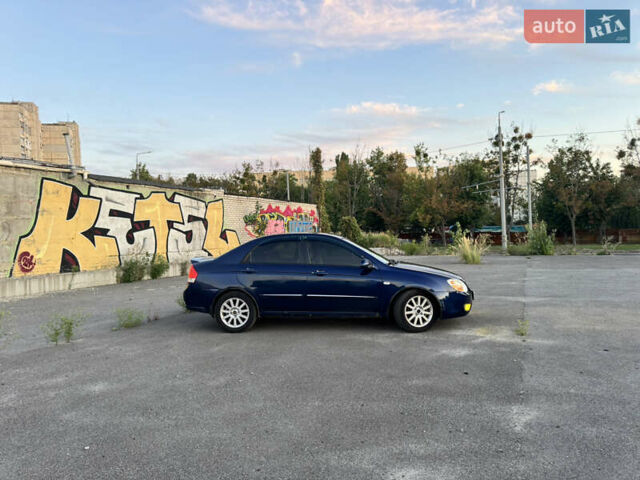 Синий Киа Черато, объемом двигателя 2 л и пробегом 258 тыс. км за 5500 $, фото 3 на Automoto.ua