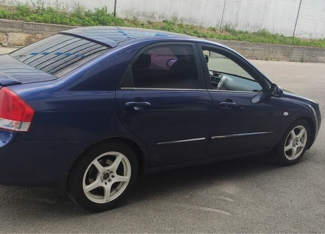 Синий Киа Черато, объемом двигателя 2 л и пробегом 420 тыс. км за 3900 $, фото 2 на Automoto.ua