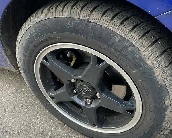 Синій Кіа Черато, об'ємом двигуна 2 л та пробігом 230 тис. км за 7350 $, фото 6 на Automoto.ua