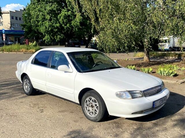Белый Киа Кларус, объемом двигателя 2 л и пробегом 200 тыс. км за 1850 $, фото 6 на Automoto.ua