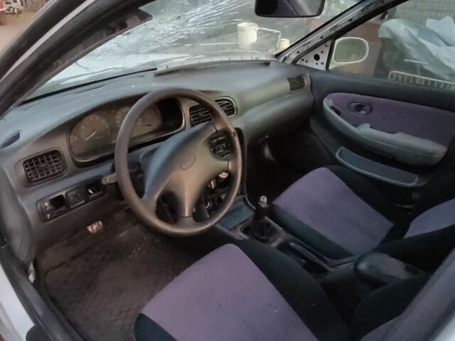 Белый Киа Кларус, объемом двигателя 2 л и пробегом 260 тыс. км за 453 $, фото 2 на Automoto.ua