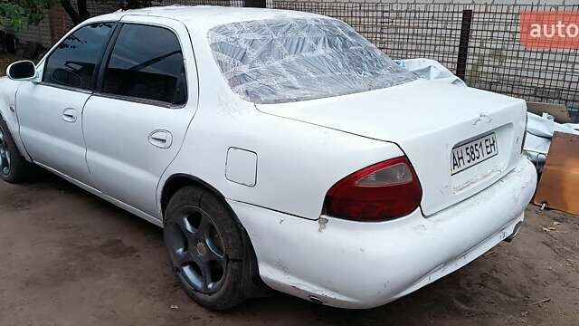 Белый Киа Кларус, объемом двигателя 1.8 л и пробегом 240 тыс. км за 427 $, фото 3 на Automoto.ua