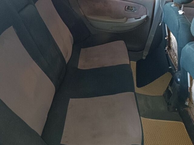 Белый Киа Кларус, объемом двигателя 2 л и пробегом 260 тыс. км за 453 $, фото 3 на Automoto.ua