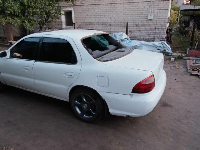 Белый Киа Кларус, объемом двигателя 2 л и пробегом 260 тыс. км за 453 $, фото 1 на Automoto.ua