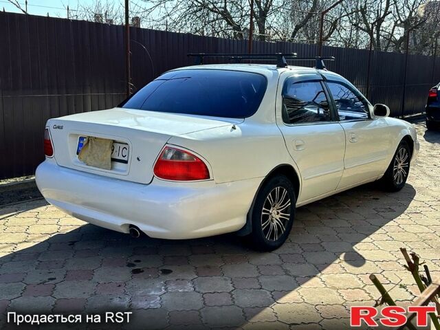 Белый Киа Кларус, объемом двигателя 1.6 л и пробегом 250 тыс. км за 2200 $, фото 11 на Automoto.ua