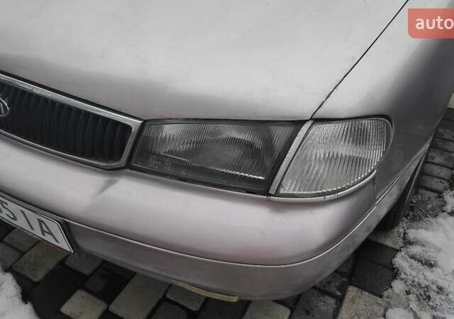 Бежевый Киа Кларус, объемом двигателя 2 л и пробегом 335 тыс. км за 800 $, фото 7 на Automoto.ua