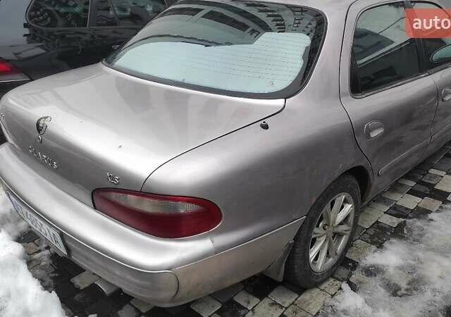 Бежевый Киа Кларус, объемом двигателя 2 л и пробегом 335 тыс. км за 800 $, фото 2 на Automoto.ua