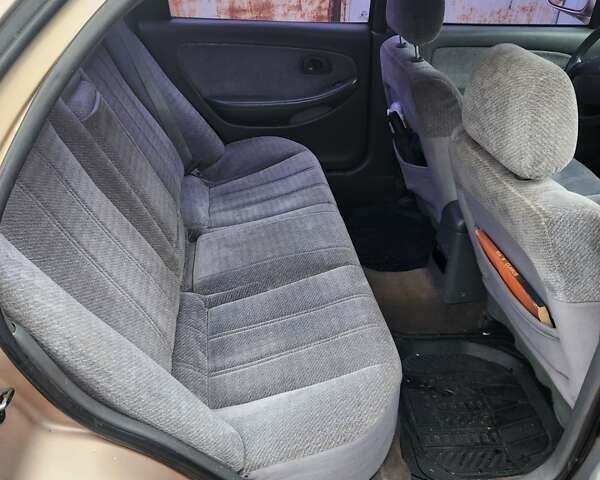 Бежевый Киа Кларус, объемом двигателя 2 л и пробегом 292 тыс. км за 2200 $, фото 14 на Automoto.ua