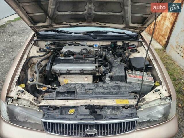 Бежевый Киа Кларус, объемом двигателя 2 л и пробегом 292 тыс. км за 2200 $, фото 9 на Automoto.ua