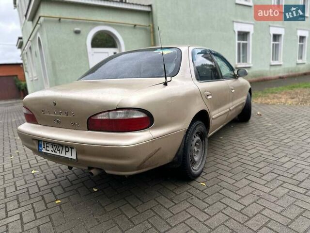Бежевый Киа Кларус, объемом двигателя 2 л и пробегом 300 тыс. км за 1500 $, фото 2 на Automoto.ua
