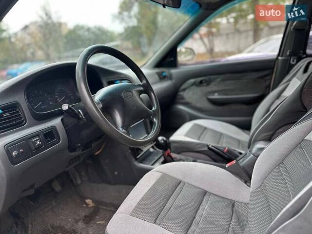Бежевый Киа Кларус, объемом двигателя 2 л и пробегом 300 тыс. км за 1500 $, фото 4 на Automoto.ua