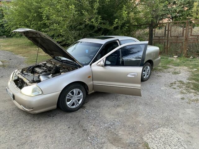 Бежевий Кіа Кларус, об'ємом двигуна 2 л та пробігом 327 тис. км за 2000 $, фото 5 на Automoto.ua