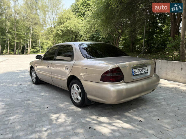 Бежевий Кіа Кларус, об'ємом двигуна 2 л та пробігом 239 тис. км за 2550 $, фото 15 на Automoto.ua