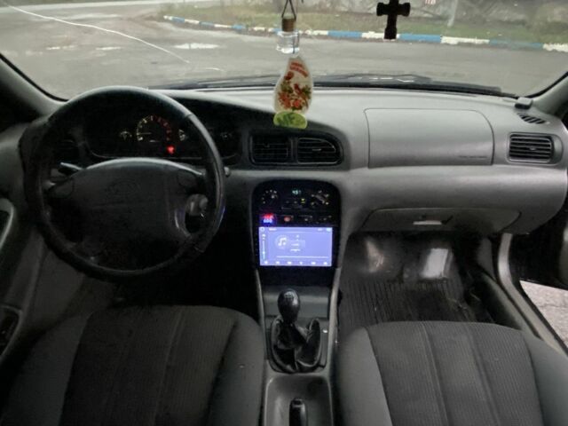 Чорний Кіа Кларус, об'ємом двигуна 2 л та пробігом 300 тис. км за 1600 $, фото 11 на Automoto.ua