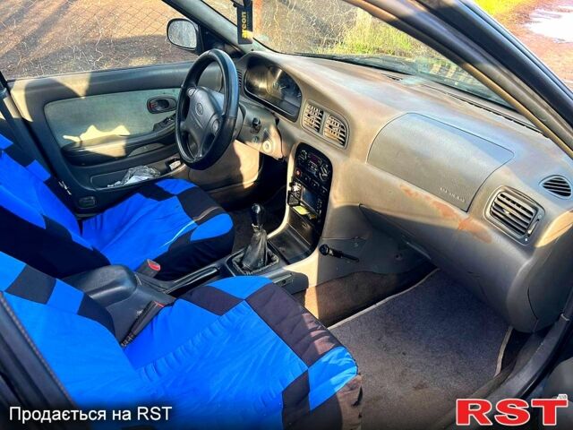 Черный Киа Кларус, объемом двигателя 2 л и пробегом 250 тыс. км за 999 $, фото 5 на Automoto.ua