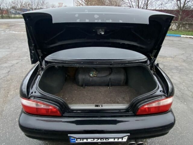 Чорний Кіа Кларус, об'ємом двигуна 2 л та пробігом 300 тис. км за 1600 $, фото 4 на Automoto.ua