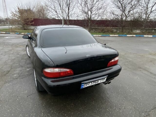 Чорний Кіа Кларус, об'ємом двигуна 2 л та пробігом 300 тис. км за 1600 $, фото 2 на Automoto.ua