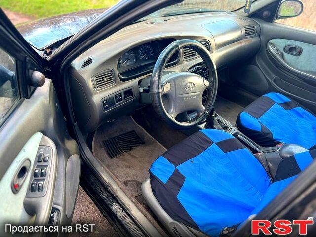 Черный Киа Кларус, объемом двигателя 2 л и пробегом 250 тыс. км за 999 $, фото 4 на Automoto.ua