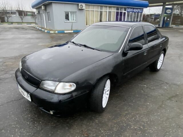 Чорний Кіа Кларус, об'ємом двигуна 2 л та пробігом 300 тис. км за 1600 $, фото 1 на Automoto.ua