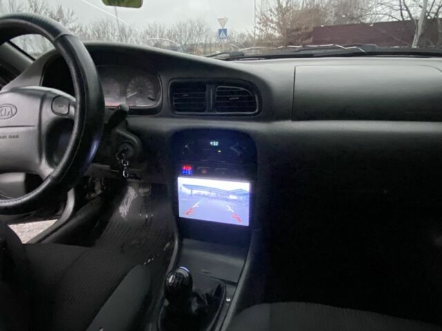 Чорний Кіа Кларус, об'ємом двигуна 2 л та пробігом 300 тис. км за 1600 $, фото 12 на Automoto.ua