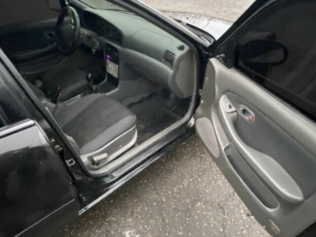 Чорний Кіа Кларус, об'ємом двигуна 2 л та пробігом 300 тис. км за 1600 $, фото 9 на Automoto.ua