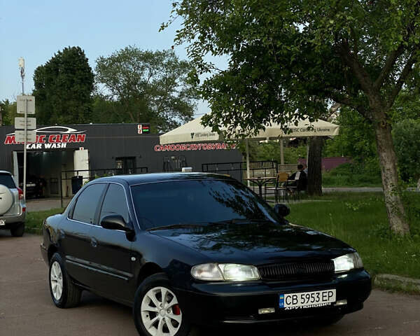 Черный Киа Кларус, объемом двигателя 1.8 л и пробегом 235 тыс. км за 2500 $, фото 3 на Automoto.ua