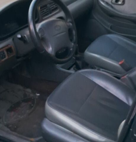 Черный Киа Кларус, объемом двигателя 2 л и пробегом 250 тыс. км за 850 $, фото 2 на Automoto.ua