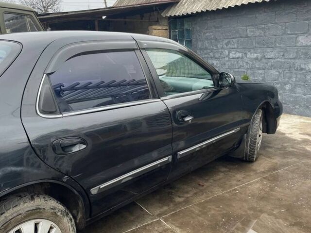 Черный Киа Кларус, объемом двигателя 2 л и пробегом 310 тыс. км за 1750 $, фото 1 на Automoto.ua