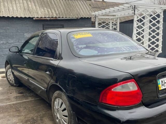 Черный Киа Кларус, объемом двигателя 2 л и пробегом 310 тыс. км за 1750 $, фото 3 на Automoto.ua