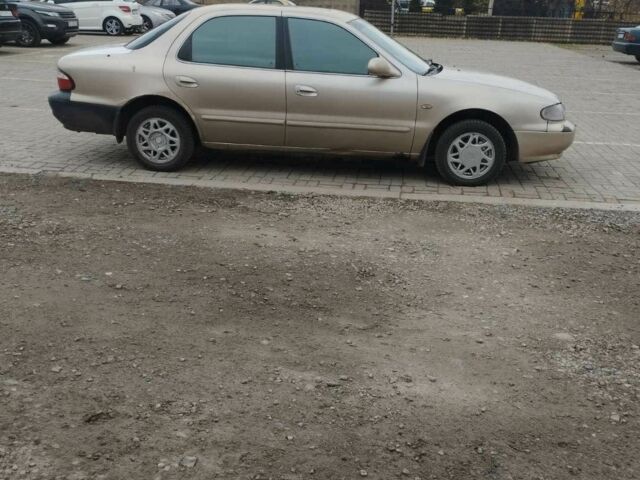 Коричневый Киа Кларус, объемом двигателя 2 л и пробегом 232 тыс. км за 1700 $, фото 1 на Automoto.ua