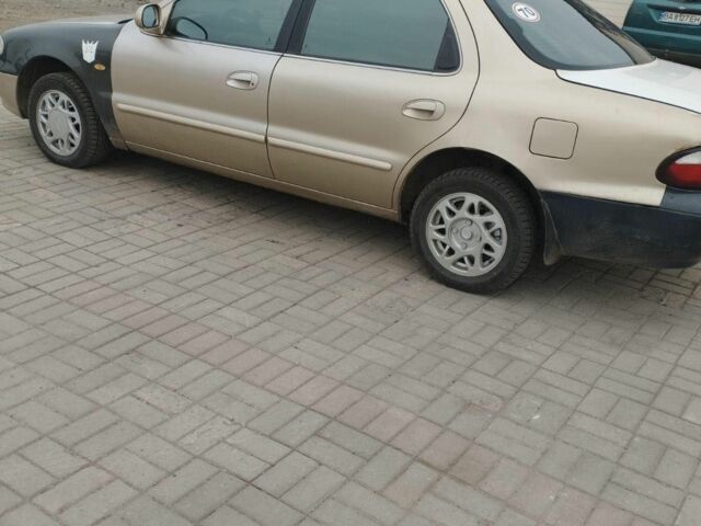 Коричневый Киа Кларус, объемом двигателя 2 л и пробегом 232 тыс. км за 1700 $, фото 3 на Automoto.ua