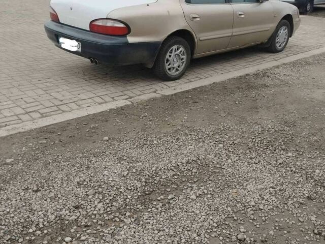 Коричневый Киа Кларус, объемом двигателя 2 л и пробегом 232 тыс. км за 1700 $, фото 2 на Automoto.ua