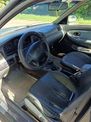 Киа Кларус, объемом двигателя 2 л и пробегом 332 тыс. км за 1000 $, фото 10 на Automoto.ua