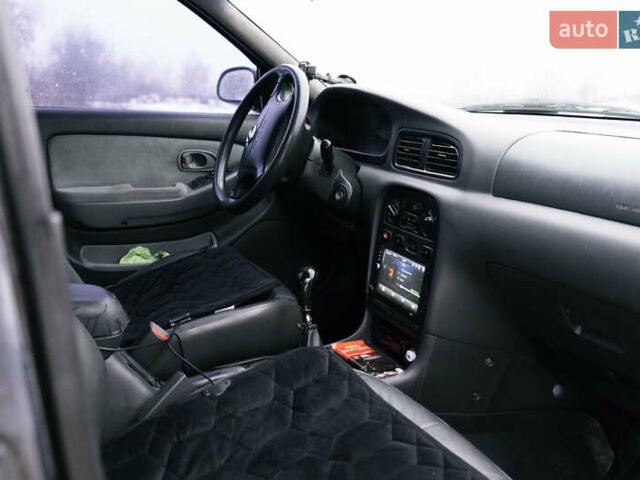 Серый Киа Кларус, объемом двигателя 2 л и пробегом 280 тыс. км за 1350 $, фото 9 на Automoto.ua
