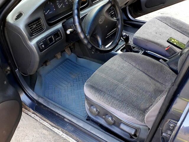 Кіа Кларус 1998 у Запоріжжя на Automoto.ua Сірий Кіа Кларус, об'ємом двигуна 2 л та пробігом 100 тис. км за 2300 $, фото 7 на Automoto.ua