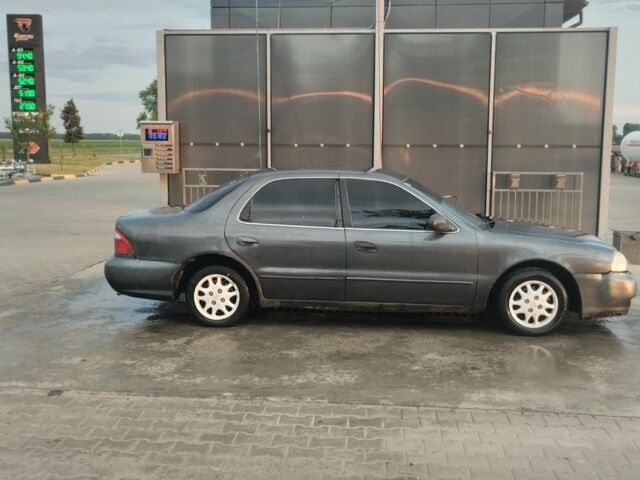 Серый Киа Кларус, объемом двигателя 2 л и пробегом 250 тыс. км за 1600 $, фото 1 на Automoto.ua