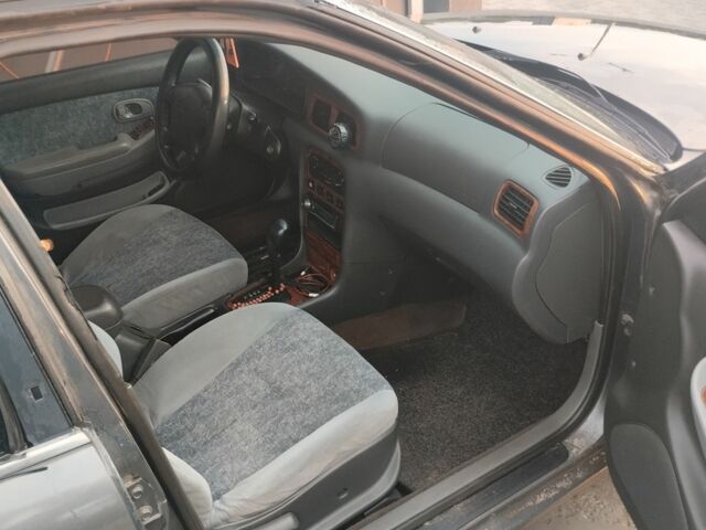 Серый Киа Кларус, объемом двигателя 2 л и пробегом 250 тыс. км за 1600 $, фото 3 на Automoto.ua