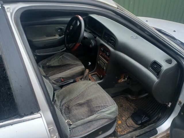 Сірий Кіа Кларус, об'ємом двигуна 1.8 л та пробігом 500 тис. км за 947 $, фото 4 на Automoto.ua