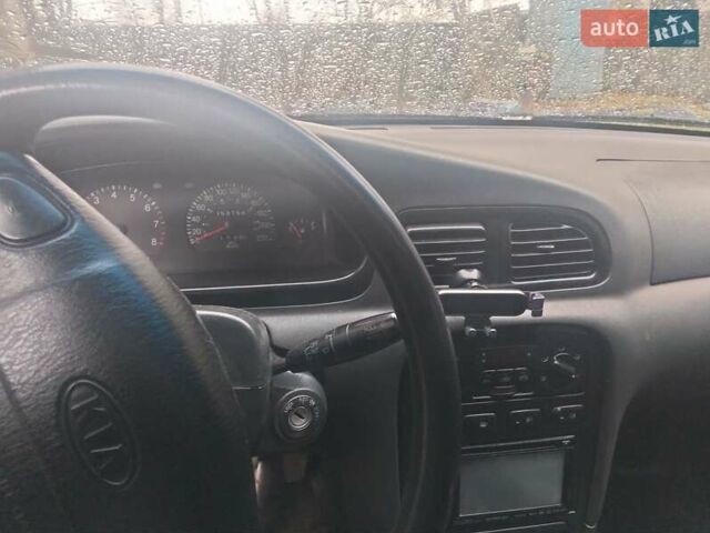 Сірий Кіа Кларус, об'ємом двигуна 2 л та пробігом 352 тис. км за 2000 $, фото 14 на Automoto.ua