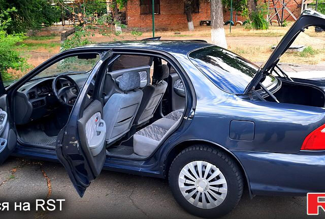 Серый Киа Кларус, объемом двигателя 2 л и пробегом 295 тыс. км за 3000 $, фото 2 на Automoto.ua