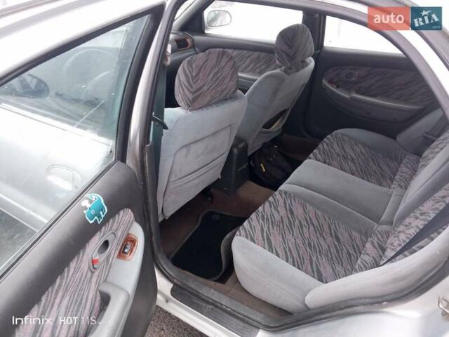 Серый Киа Кларус, объемом двигателя 1.8 л и пробегом 279 тыс. км за 1430 $, фото 4 на Automoto.ua