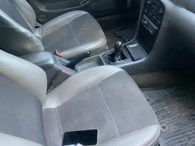 Синий Киа Кларус, объемом двигателя 2 л и пробегом 360 тыс. км за 2250 $, фото 4 на Automoto.ua