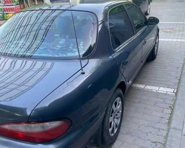 Синій Кіа Кларус, об'ємом двигуна 2 л та пробігом 360 тис. км за 1300 $, фото 3 на Automoto.ua