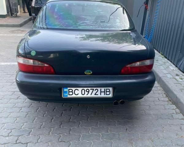 Синій Кіа Кларус, об'ємом двигуна 2 л та пробігом 360 тис. км за 1300 $, фото 2 на Automoto.ua