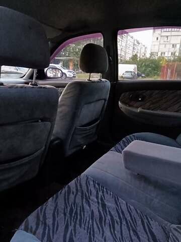 Синий Киа Кларус, объемом двигателя 1.8 л и пробегом 311 тыс. км за 999 $, фото 4 на Automoto.ua