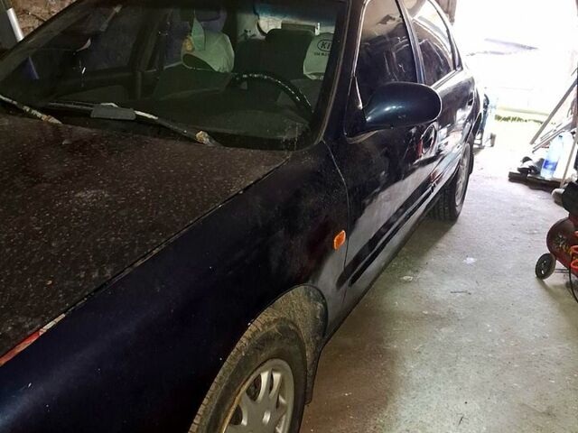 Синий Киа Кларус, объемом двигателя 2 л и пробегом 270 тыс. км за 2500 $, фото 2 на Automoto.ua