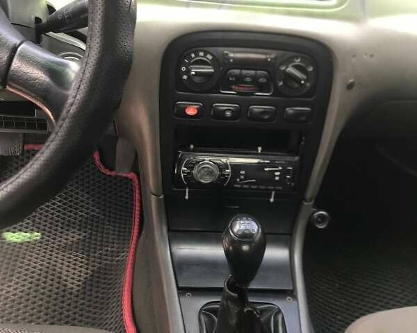 Синий Киа Кларус, объемом двигателя 2 л и пробегом 300 тыс. км за 1600 $, фото 4 на Automoto.ua
