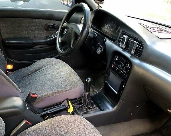 Синий Киа Кларус, объемом двигателя 2 л и пробегом 207 тыс. км за 1500 $, фото 2 на Automoto.ua