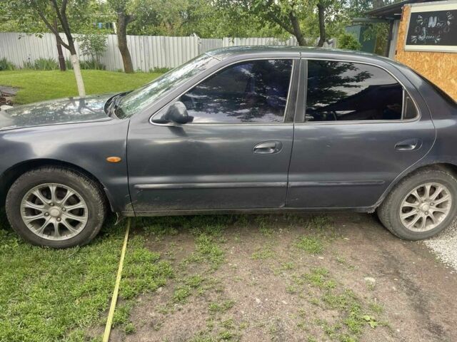 Синій Кіа Кларус, об'ємом двигуна 2 л та пробігом 301 тис. км за 1650 $, фото 3 на Automoto.ua